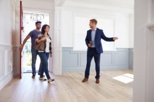 Real estate agent showing couple a house