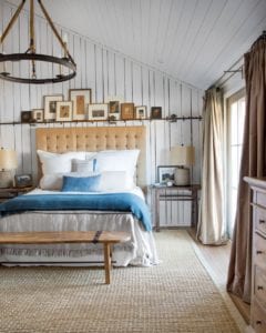 Bedroom featuring a vaulted ceiling and beautiful bed with a denim bed spread.