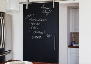Kitchen with sliding door featuring a grocery shopping list