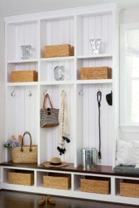 Organized cabinets with baskets in a mudroom.