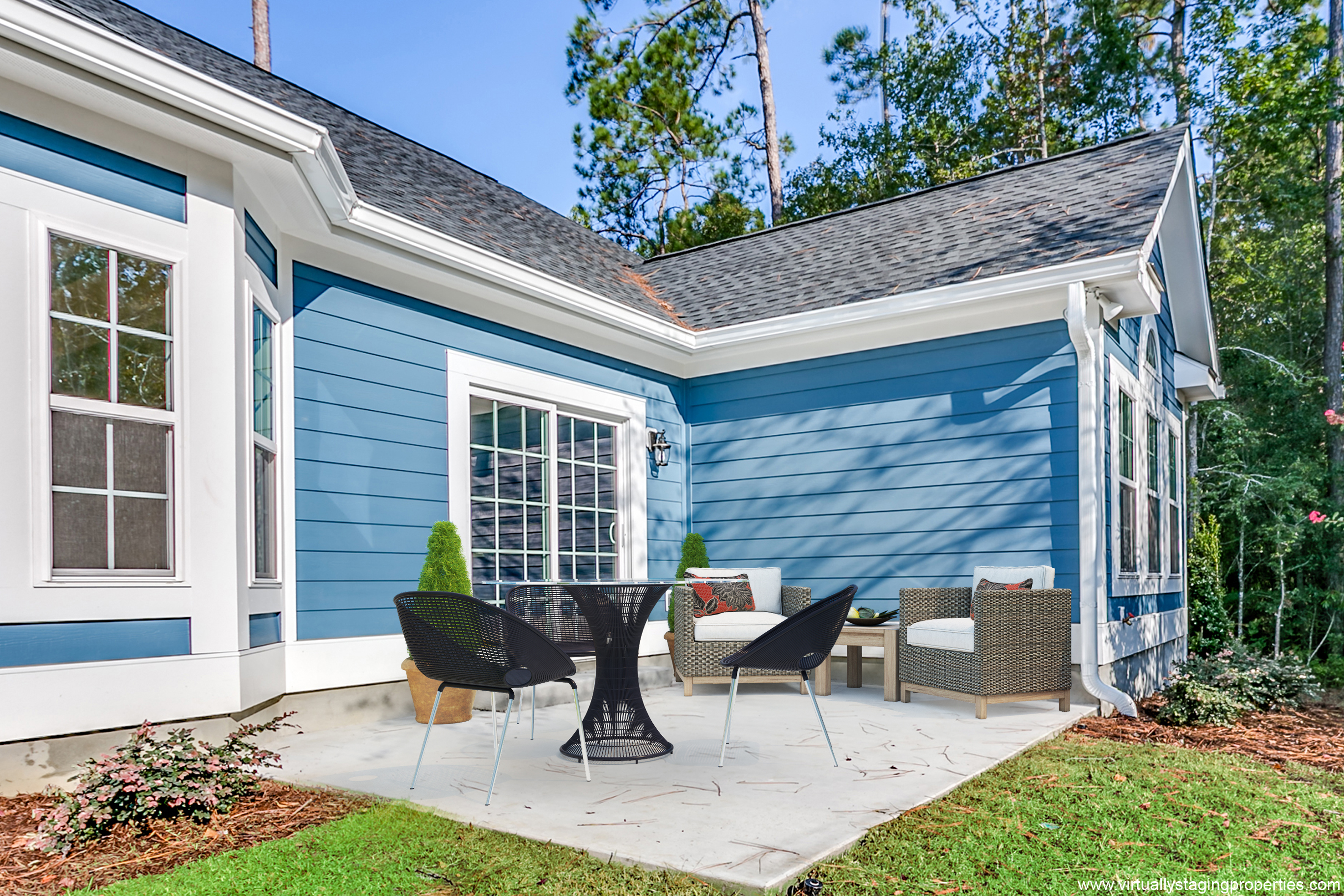 Patio and exterior of a blue home with virtual staged furniture.