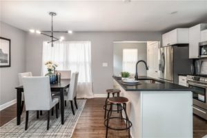 small updated kitchen with trending light fixture