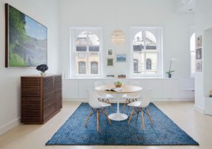blue Scandanavian rug in a dining area