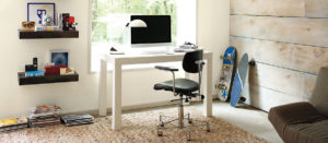 Computer desk with chair in office room