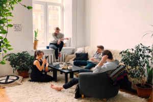 Young adults sitting in a cool apartment living room