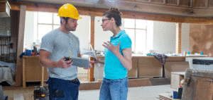 Woman talking to a contractor in her home